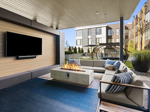 a living room with a fireplace and a television